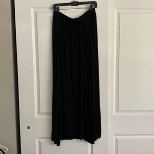 Long black skirt with high slits on both legs